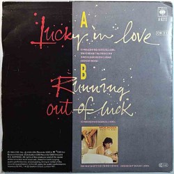 Jagger Mick: Lucky In Love / Running Out Of Luck  kansi F levy VG- käytetty vinyylisingle